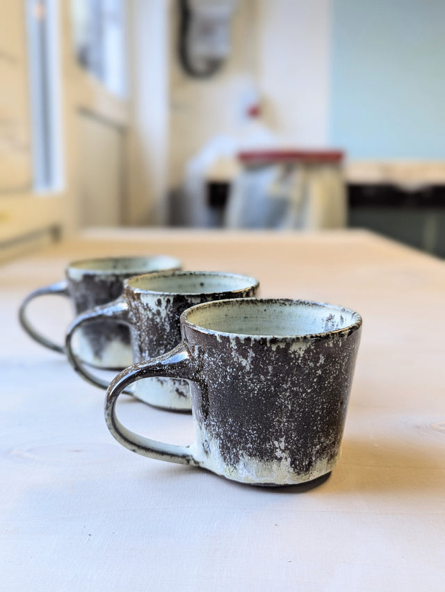 Stoneware cup with a handle