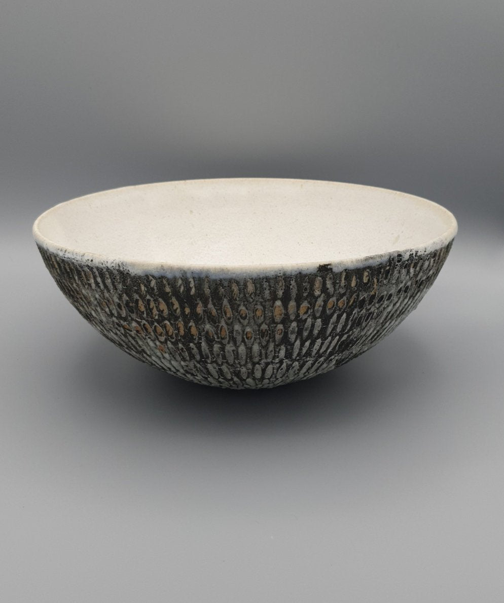 Handthrown and carved bowl.