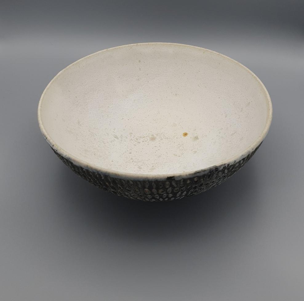 Handthrown and carved bowl.