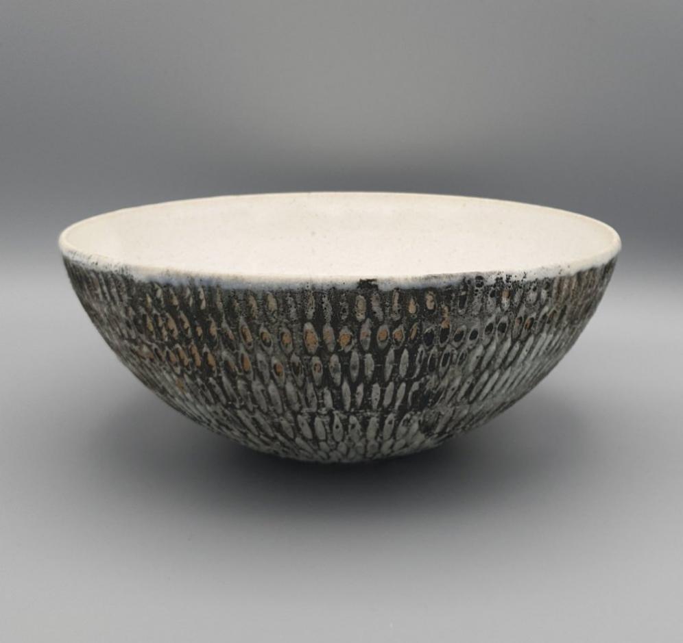 Handthrown and carved bowl.