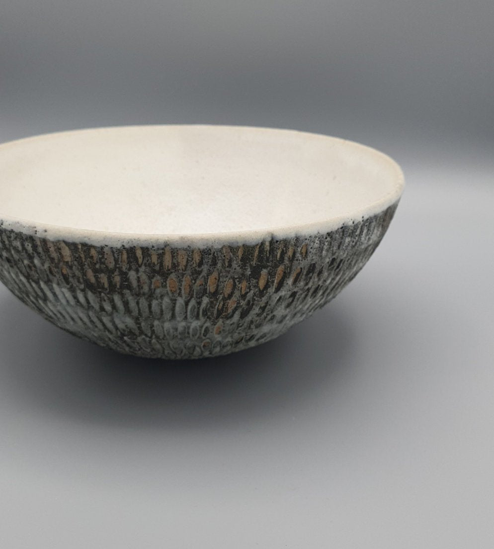 Handthrown and carved bowl.