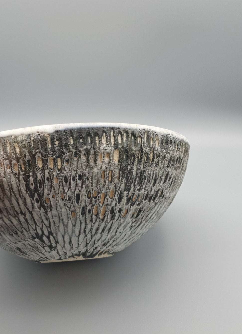 Handthrown and carved bowl.