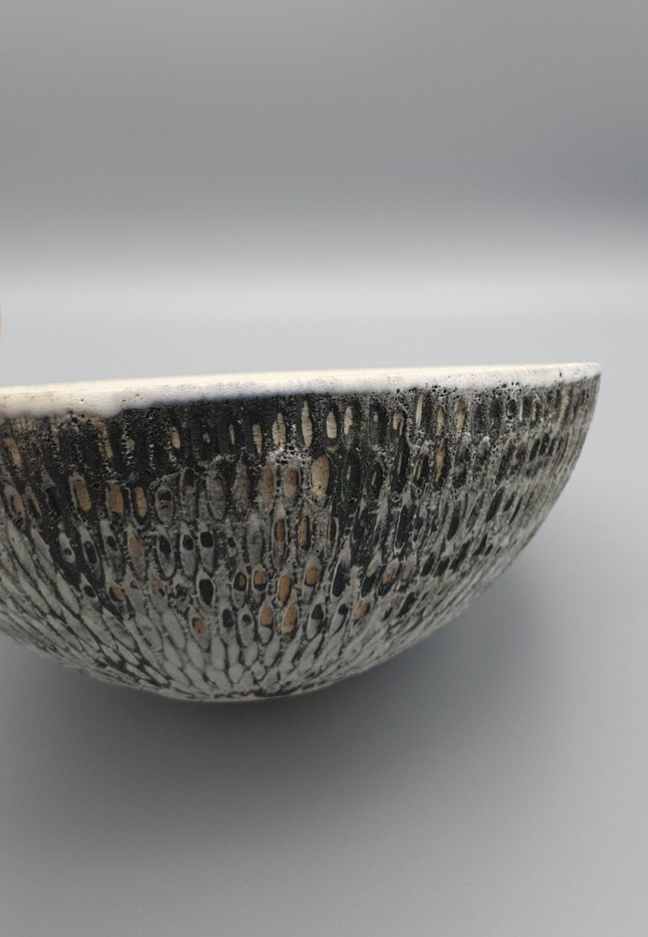 Handthrown and carved bowl.